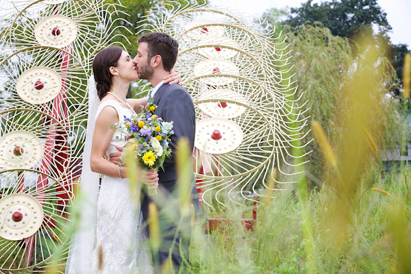 bride and groom kiss in field - wedding photo by top Philadelphia based wedding photographers Langdon Photography